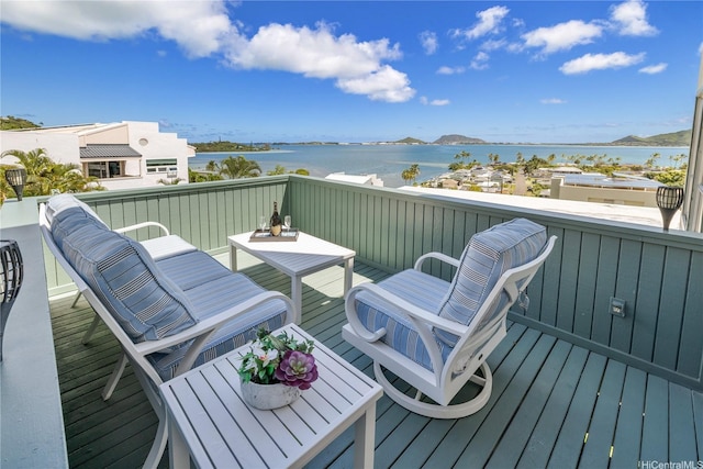 45-081 Lilipuna Rd Unit F, Kaneohe, HI 96744 - wooden terrace featuring a water view and outdoor dining space