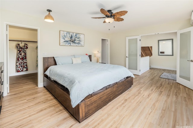 45-081 Lilipuna Rd Unit F, Kaneohe, HI 96744 - bedroom featuring light wood-style flooring, a spacious closet, and baseboards