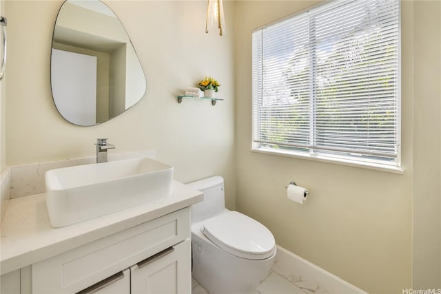 45-081 Lilipuna Rd Unit F, Kaneohe, HI 96744 - half bathroom featuring marble finish floors, toilet, vanity, and baseboards