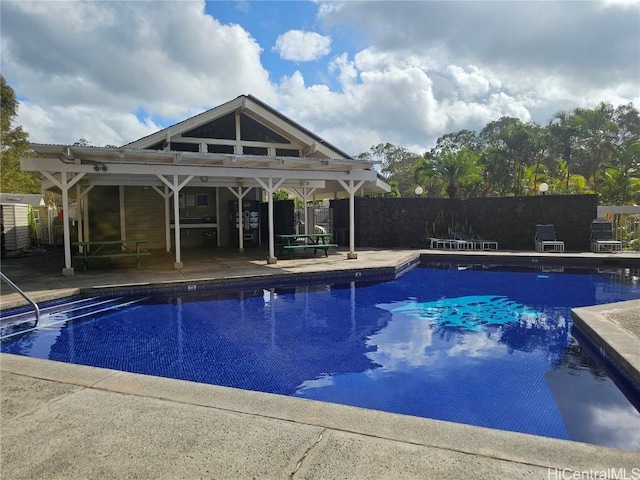 view of swimming pool with a patio area, a fenced in pool, and fence