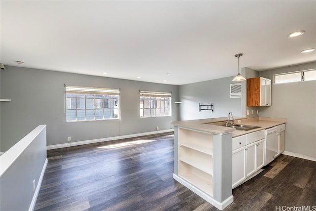 kitchen featuring a sink, open shelves, dishwasher, and dark wood-style floors