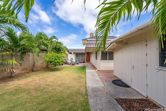 view of yard featuring a patio and fence