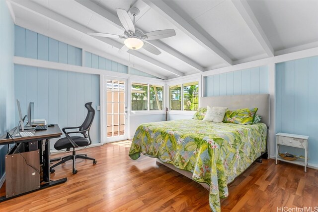 bedroom with vaulted ceiling with beams and wood finished floors