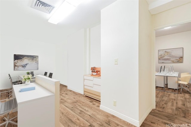 1088 Bishop St Unit 204, Honolulu, HI 96813 - home office with light wood finished floors, visible vents, and baseboards