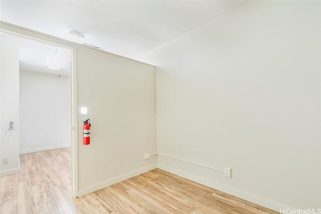 1088 Bishop St Unit 204, Honolulu, HI 96813 - empty room with light wood finished floors and baseboards