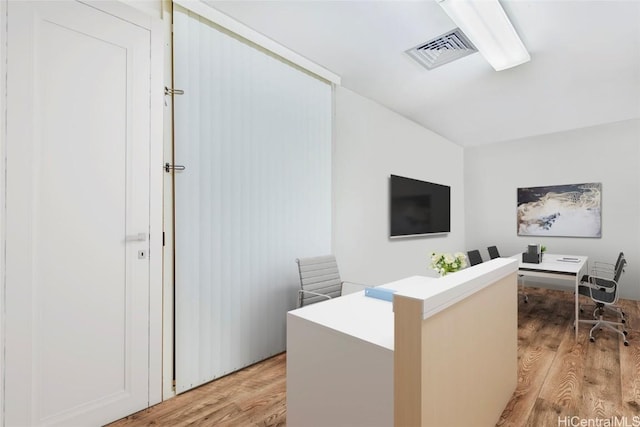 1088 Bishop St Unit 204, Honolulu, HI 96813 - home office with visible vents and light wood-style flooring
