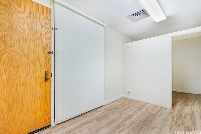 1088 Bishop St Unit 204, Honolulu, HI 96813 - unfurnished room featuring wood finished floors, visible vents, and baseboards
