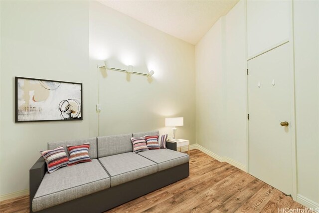 1088 Bishop St Unit 204, Honolulu, HI 96813 - living area featuring baseboards and wood finished floors