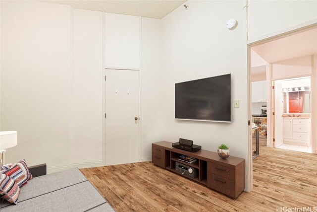 1088 Bishop St Unit 204, Honolulu, HI 96813 - living area with light wood-style flooring