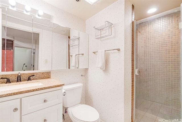 1088 Bishop St Unit 204, Honolulu, HI 96813 - full bath with wallpapered walls, toilet, vanity, and a tile shower