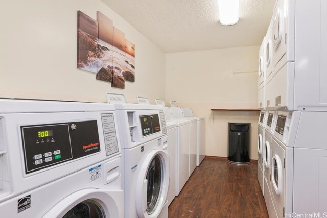 1088 Bishop St Unit 204, Honolulu, HI 96813 - community laundry room with a textured ceiling, separate washer and dryer, dark wood-style flooring, and stacked washing maching and dryer