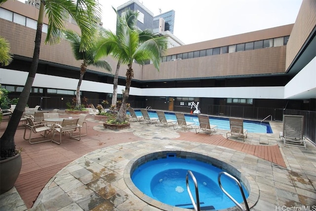 1088 Bishop St Unit 204, Honolulu, HI 96813 - pool with a patio area and a hot tub