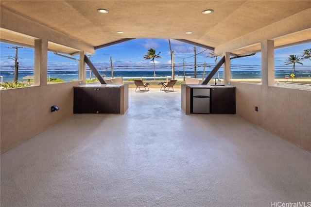 view of patio featuring exterior kitchen and a sink