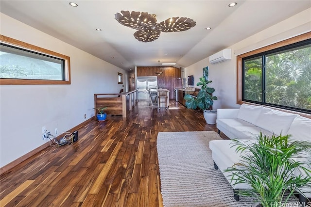 living room with recessed lighting, baseboards, wood-type flooring, and a wall mounted AC