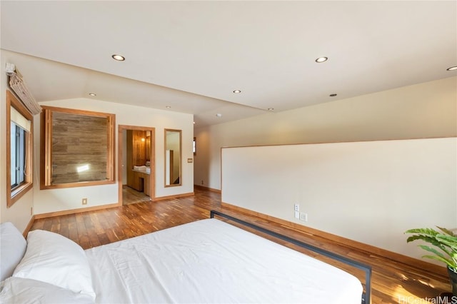 bedroom featuring recessed lighting, baseboards, hardwood / wood-style floors, and vaulted ceiling