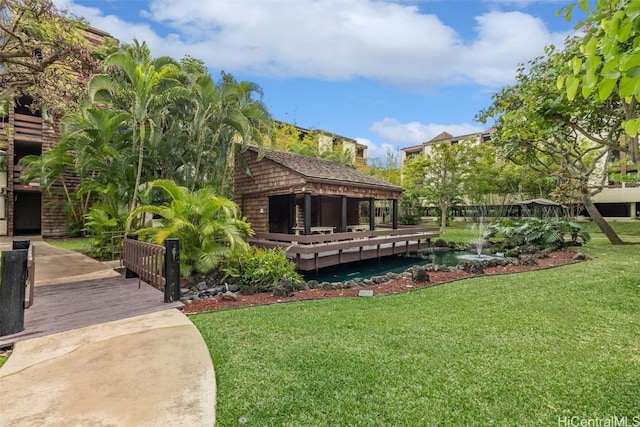 rear view of property with a lawn