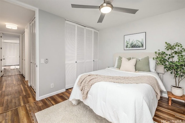 bedroom featuring baseboards, dark wood-style flooring, and ceiling fan