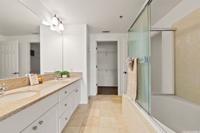 520 Lunalilo Home Rd Unit 8203, Honolulu, HI 96825 - full bath featuring a shower with shower door, double vanity, a tub to relax in, tile patterned floors, and a walk in closet