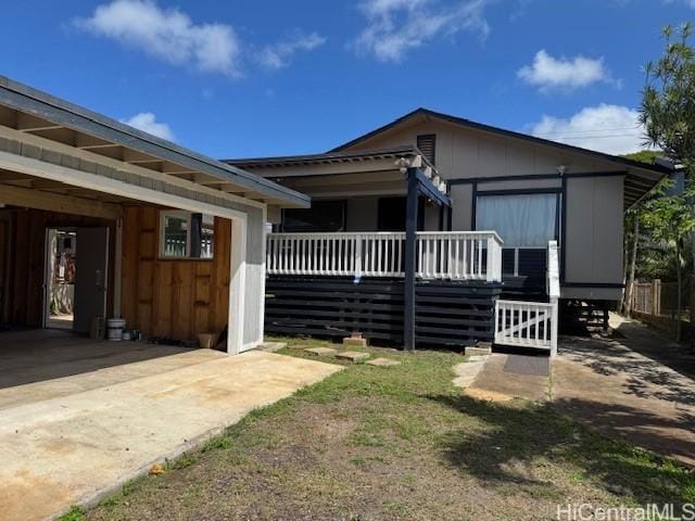 view of front of property with a wooden deck