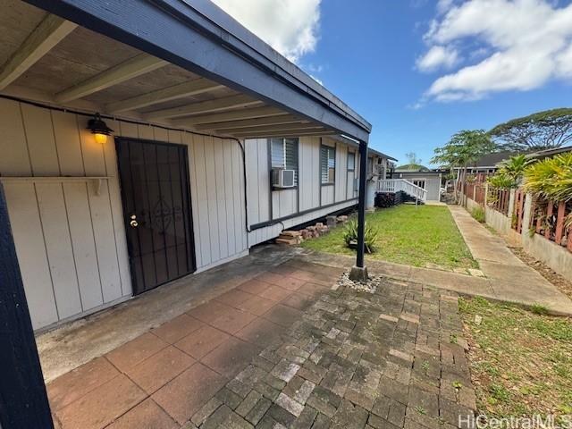 view of patio with cooling unit and fence