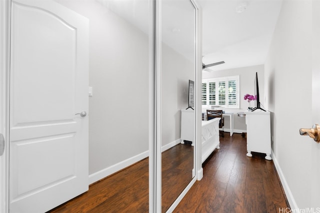 interior space featuring baseboards and wood-type flooring