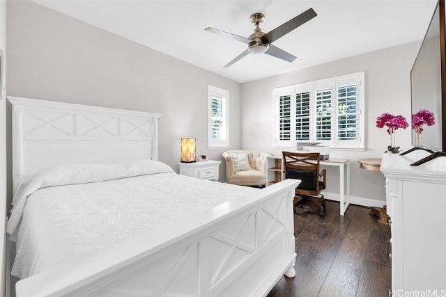 bedroom with dark wood-style floors, baseboards, and ceiling fan