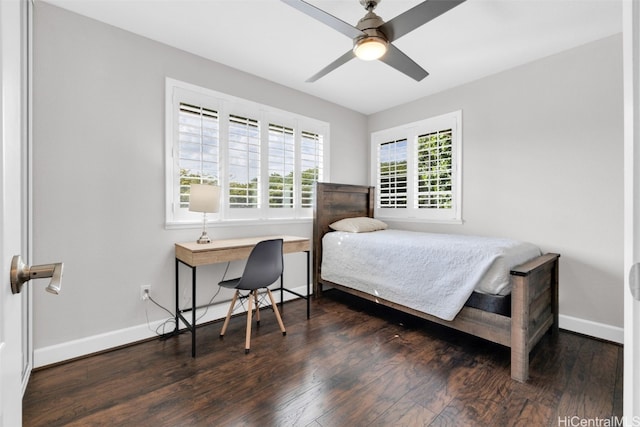 bedroom featuring baseboards and wood finished floors