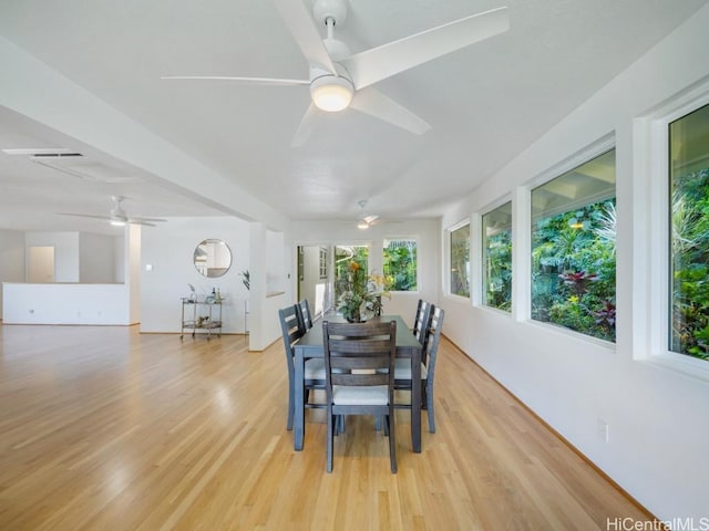 dining room with light wood-type flooring and ceiling fan