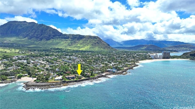aerial view featuring a water and mountain view