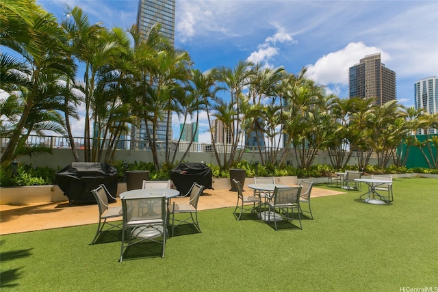 909 Kapiolani Blvd Unit 701, Honolulu, HI 96814 - view of yard with a patio area and a view of city
