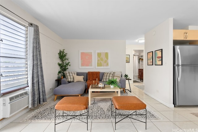 living area featuring cooling unit, baseboards, and light tile patterned flooring