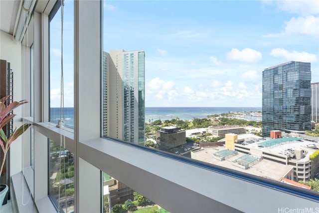 balcony featuring a view of city and a water view