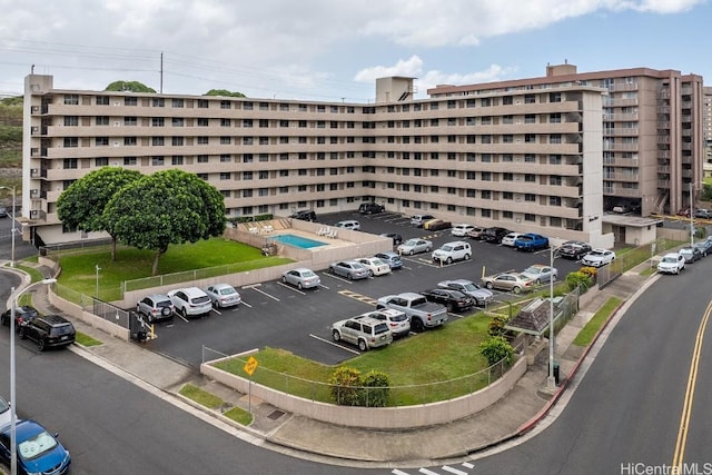 view of property featuring uncovered parking