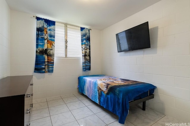 bedroom with light tile patterned floors