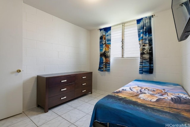 bedroom featuring light tile patterned flooring