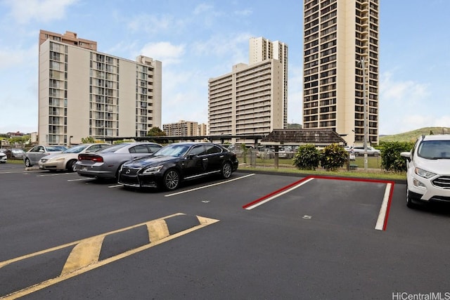 uncovered parking lot with a city view