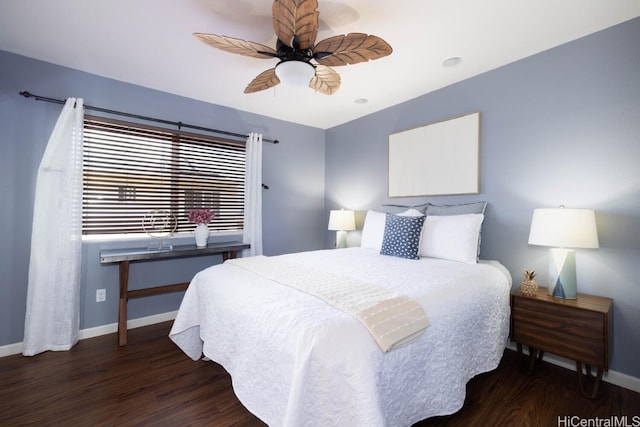 bedroom with a ceiling fan, wood finished floors, and baseboards