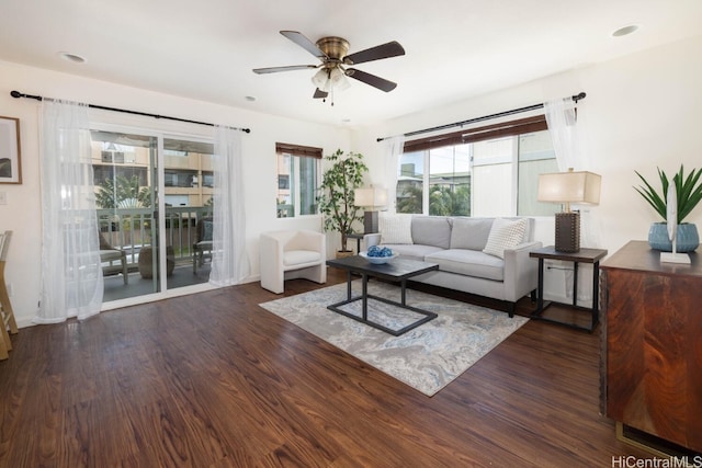 living room with ceiling fan and wood finished floors