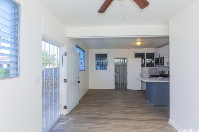 kitchen with wood finished floors and appliances with stainless steel finishes