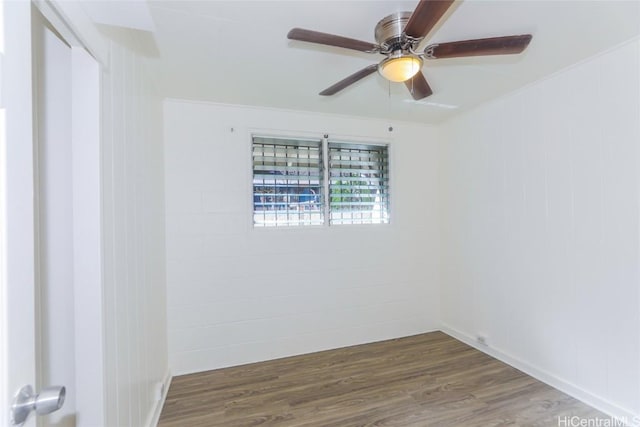 unfurnished room featuring a ceiling fan and dark wood-style flooring