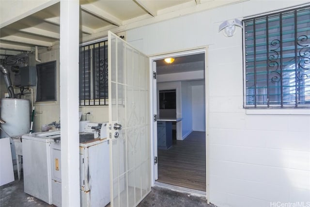 entrance to property featuring washer / clothes dryer and water heater