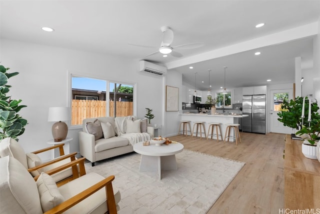 91-1046 Kauiki St, Ewa Beach, HI 96706 - living area with a wall unit AC, a ceiling fan, lofted ceiling, recessed lighting, and light wood-style floors