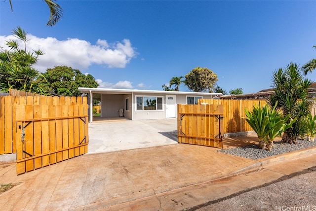 91-1046 Kauiki St, Ewa Beach, HI 96706 - exterior space with an attached carport, a gate, fence, and driveway