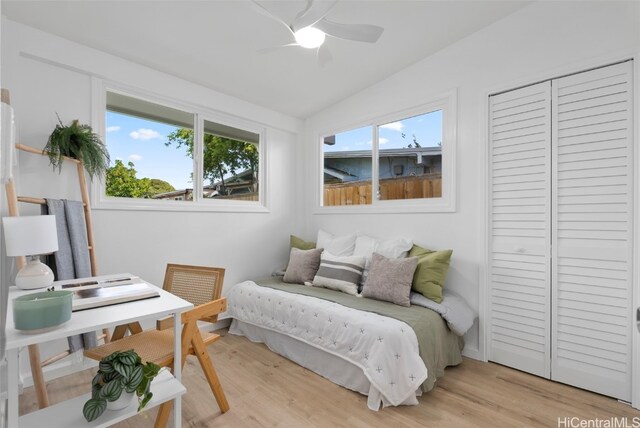 91-1046 Kauiki St, Ewa Beach, HI 96706 - bedroom with a closet, lofted ceiling, light wood-style floors, and a ceiling fan