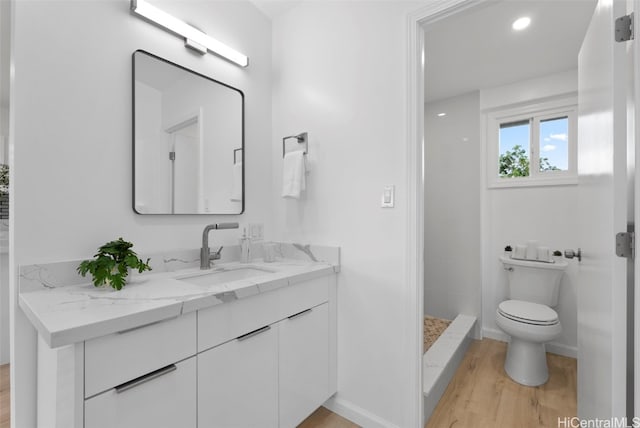 91-1046 Kauiki St, Ewa Beach, HI 96706 - bathroom featuring vanity, wood finished floors, baseboards, a shower stall, and toilet