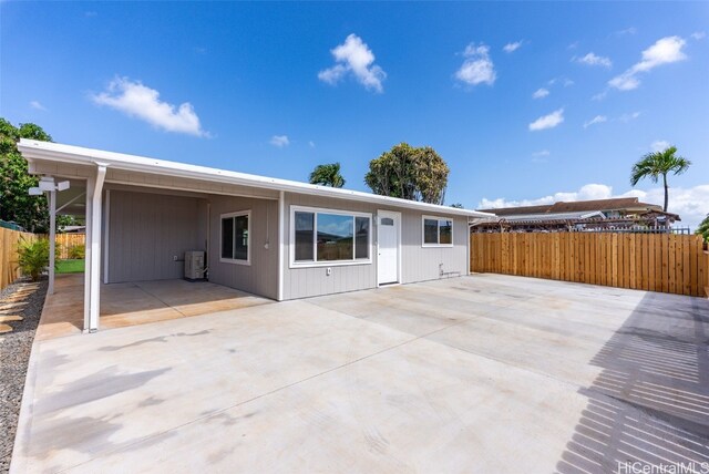 91-1046 Kauiki St, Ewa Beach, HI 96706 - back of property with an attached carport, a patio, and fence