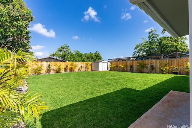 91-1046 Kauiki St, Ewa Beach, HI 96706 - view of yard with an outdoor structure, a storage unit, and a fenced backyard