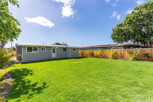 91-1046 Kauiki St, Ewa Beach, HI 96706 - back of house with a yard and fence