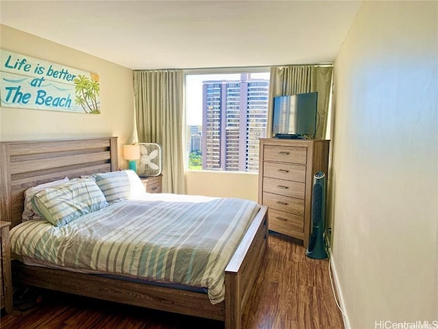 bedroom featuring dark wood-type flooring