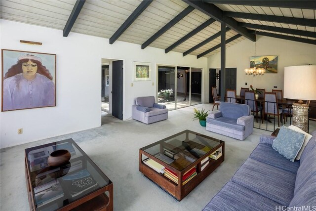 living area featuring carpet flooring, beamed ceiling, wood ceiling, and an inviting chandelier